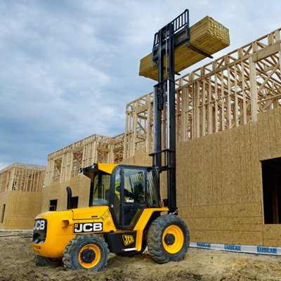Forklift unloading machinery and industrial equipment in Harrow